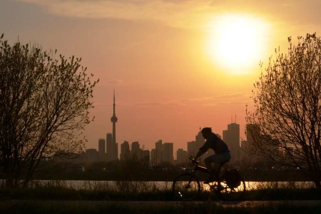 Cycling with the view of sunset over Downtown Toronto