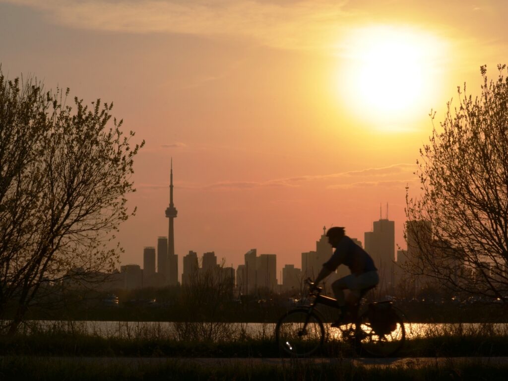 Cycling with the view of sunset over Downtown Toronto