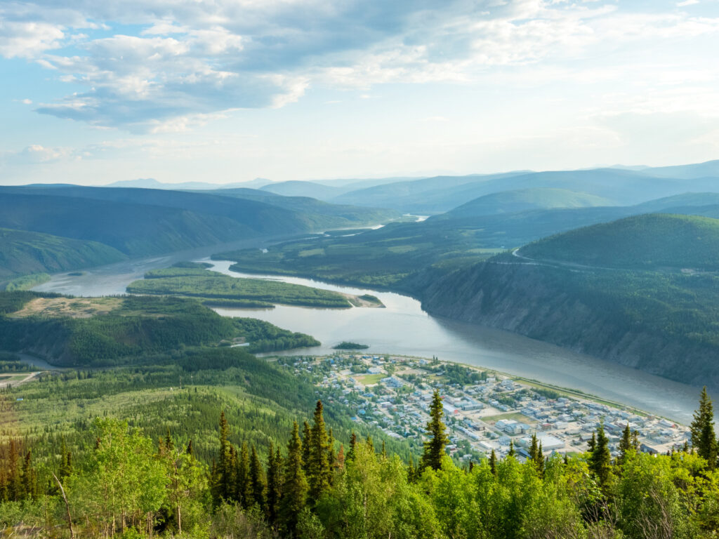 Panoramic view of Dawson city and Yukon river from the top of Midnight Dome mountain