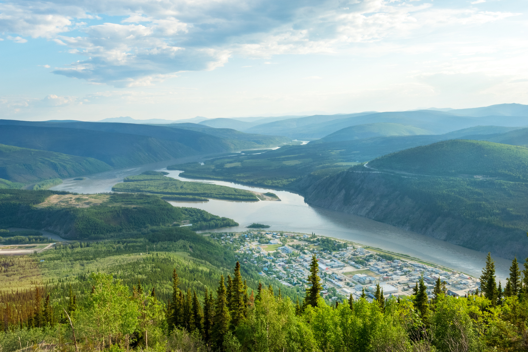 Panoramic view of Dawson city and Yukon river from the top of Midnight Dome mountain