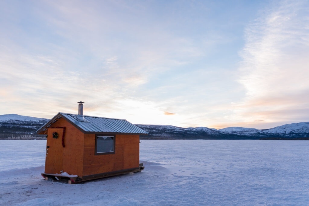 Ice Fishing Cabin on a Frozen Lake in the Yukon Territory