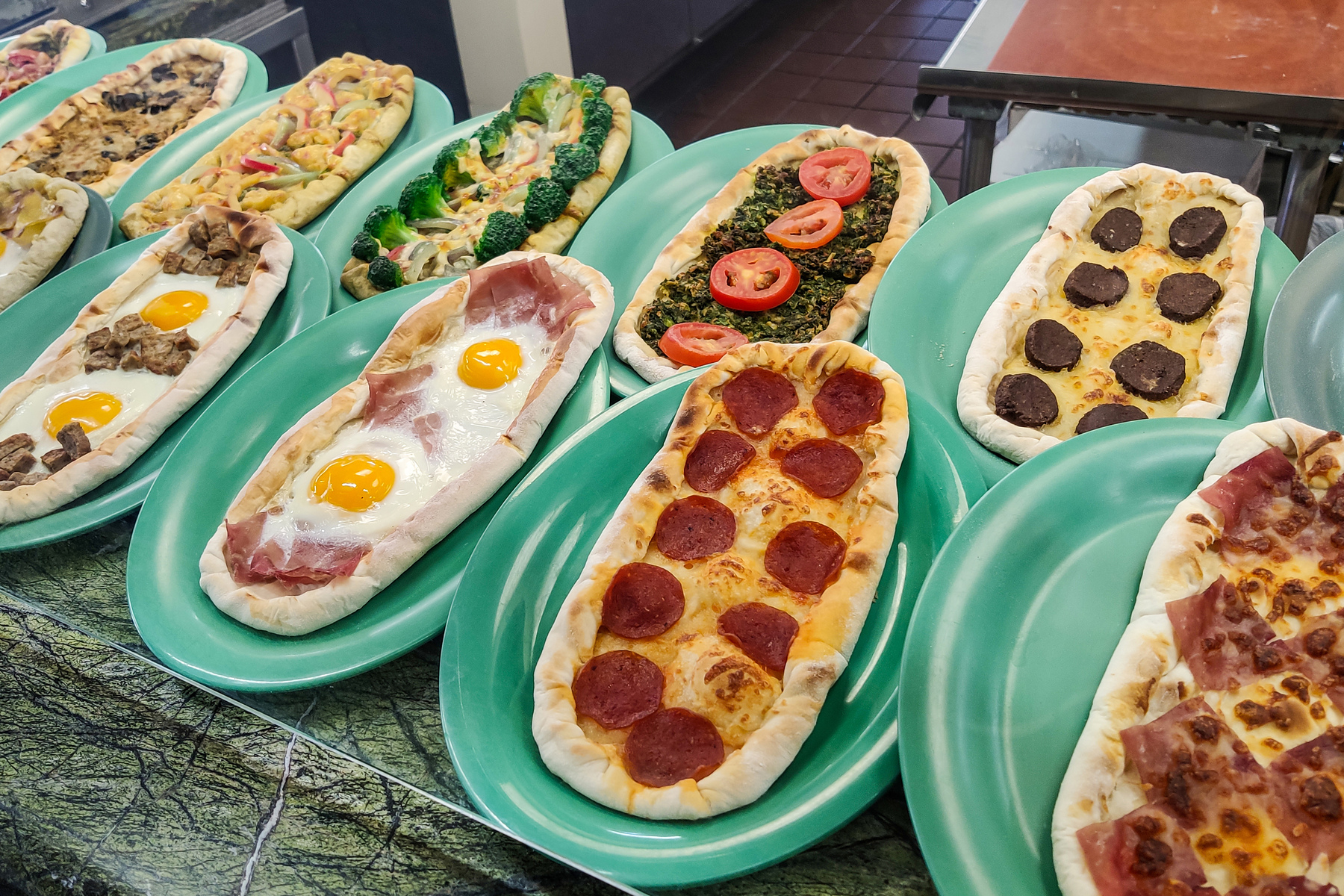 Delicious turkish pide with cheese, eggs or vegetables, at the farmers market in Los Angeles