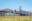 Two bicycles parked on grass in front of Golden Gate Bridge