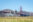 Two bicycles parked on grass in front of Golden Gate Bridge