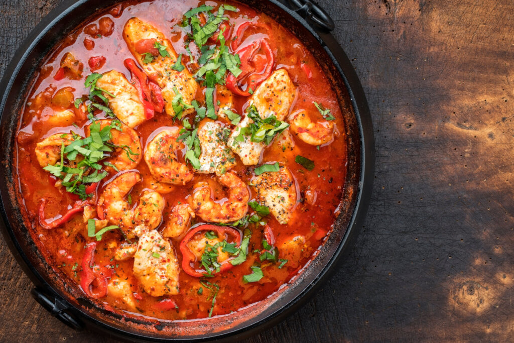 Traditional Creole cajun court bouillon with fish and seafood gumbo chowder stew