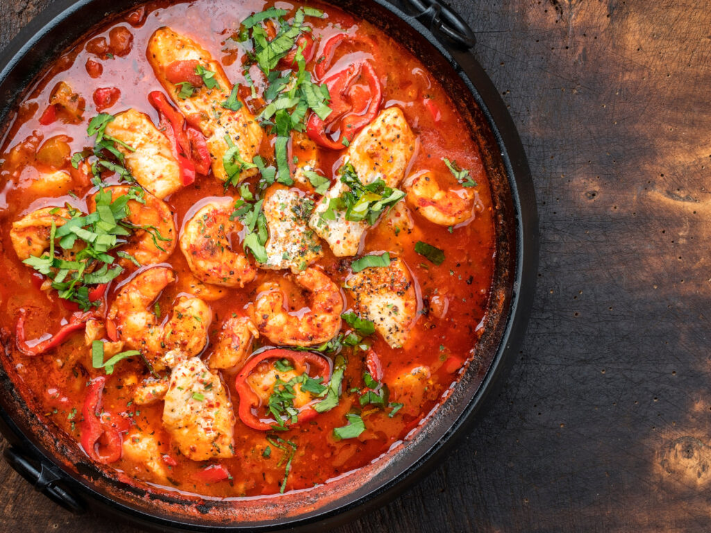 Traditional Creole cajun court bouillon with fish and seafood gumbo chowder stew