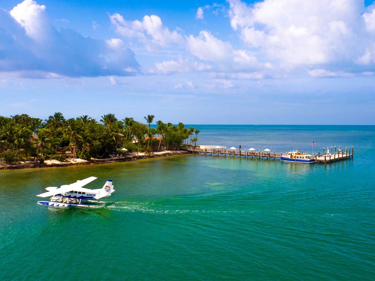 Plane landing in the water outside the resort