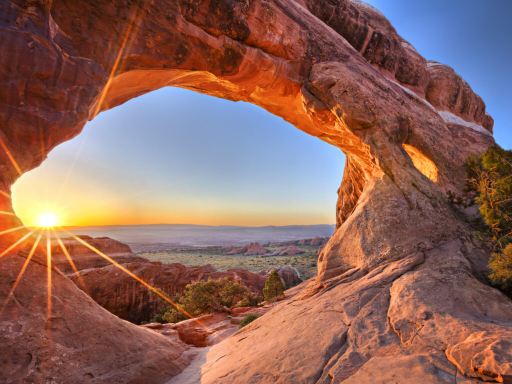 Sunrise at Partition Arch, in Arches National Park.