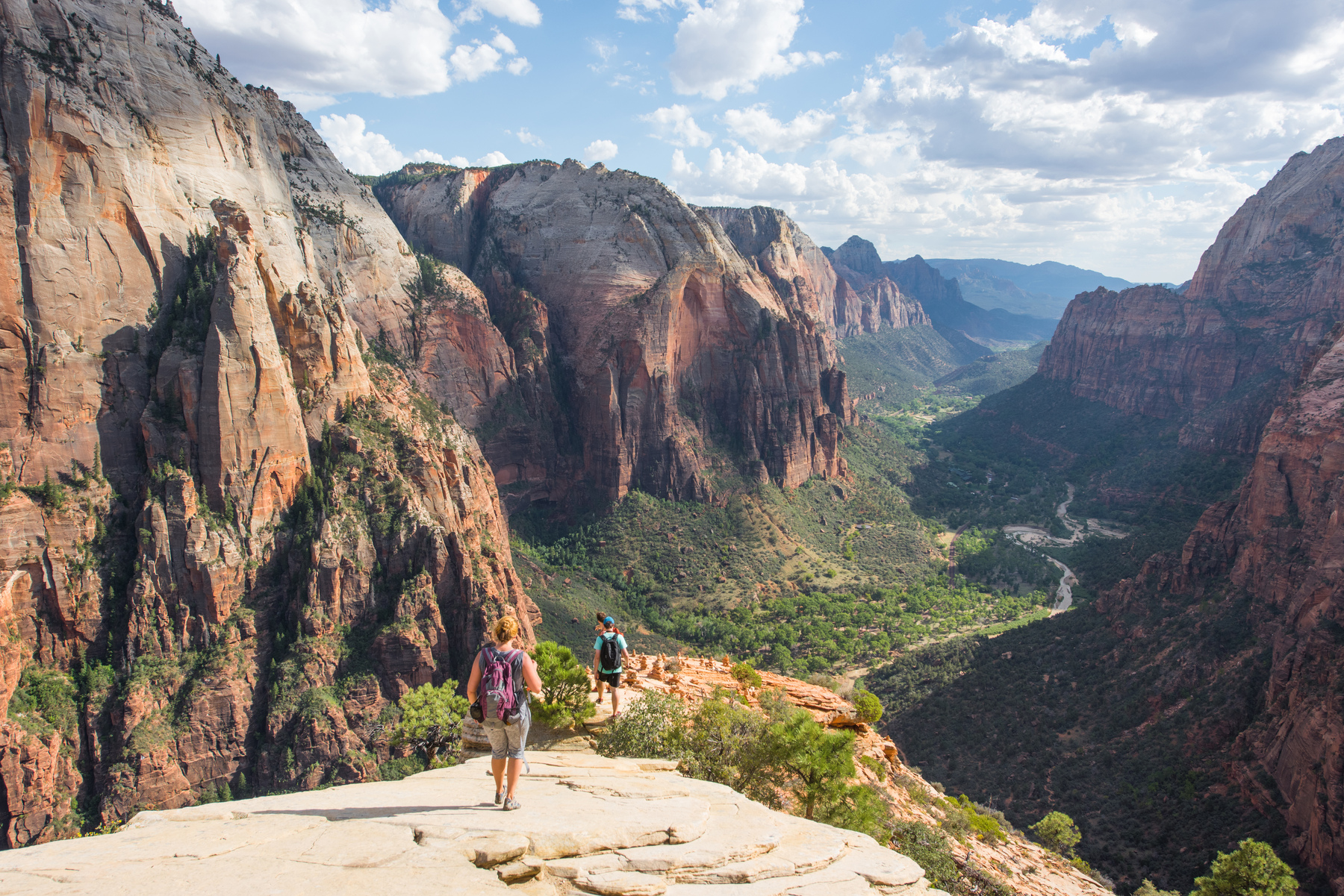 Hikers on Canyon view point in Zion National Park on a summer day