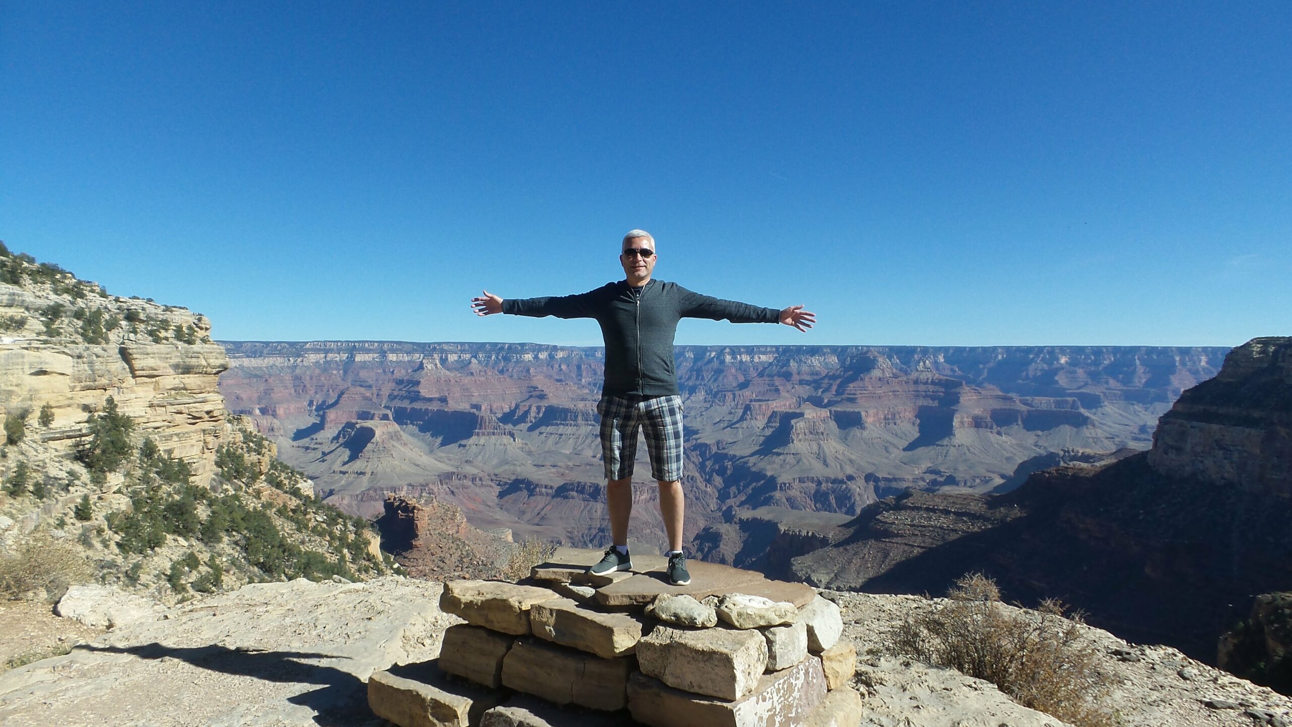 Bo standing over the Grand Canyon