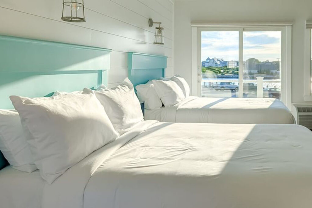 Hotel guest room with two beds facing the ocean