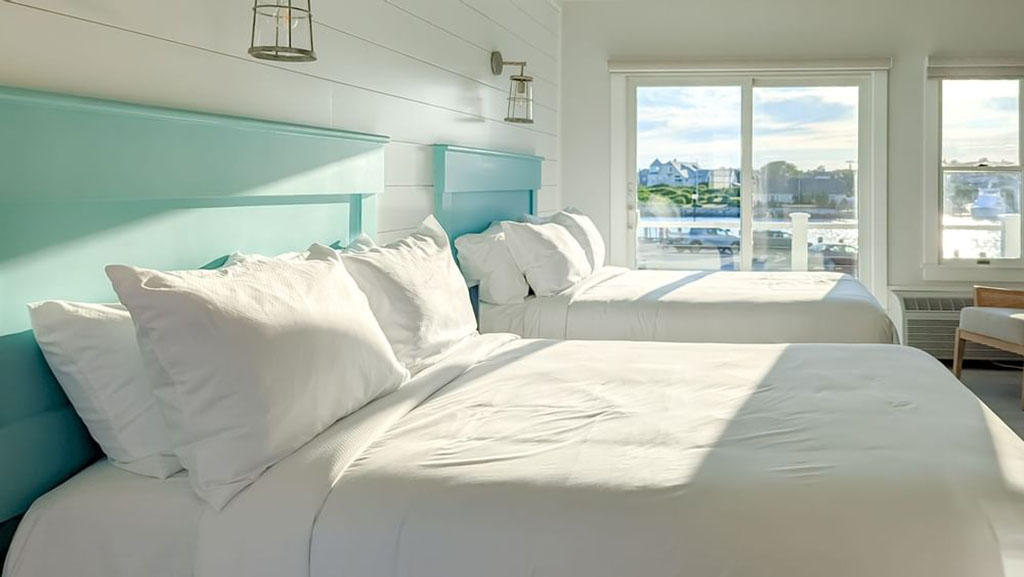 Hotel guest room with two beds facing the ocean