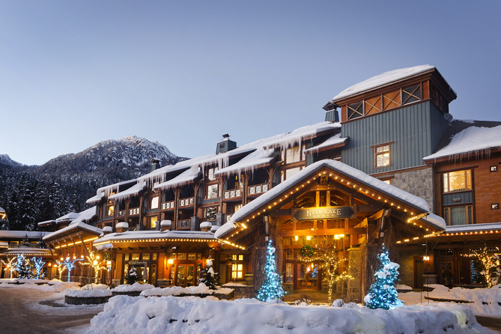 Hotel exterior lit up at dusk