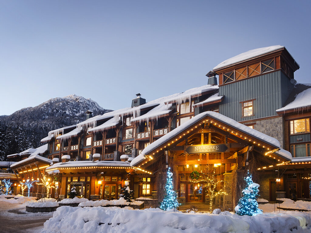 Hotel exterior lit up at dusk