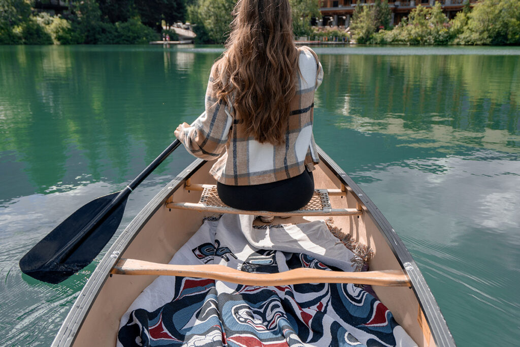 Hotel guest canoeing in the lake