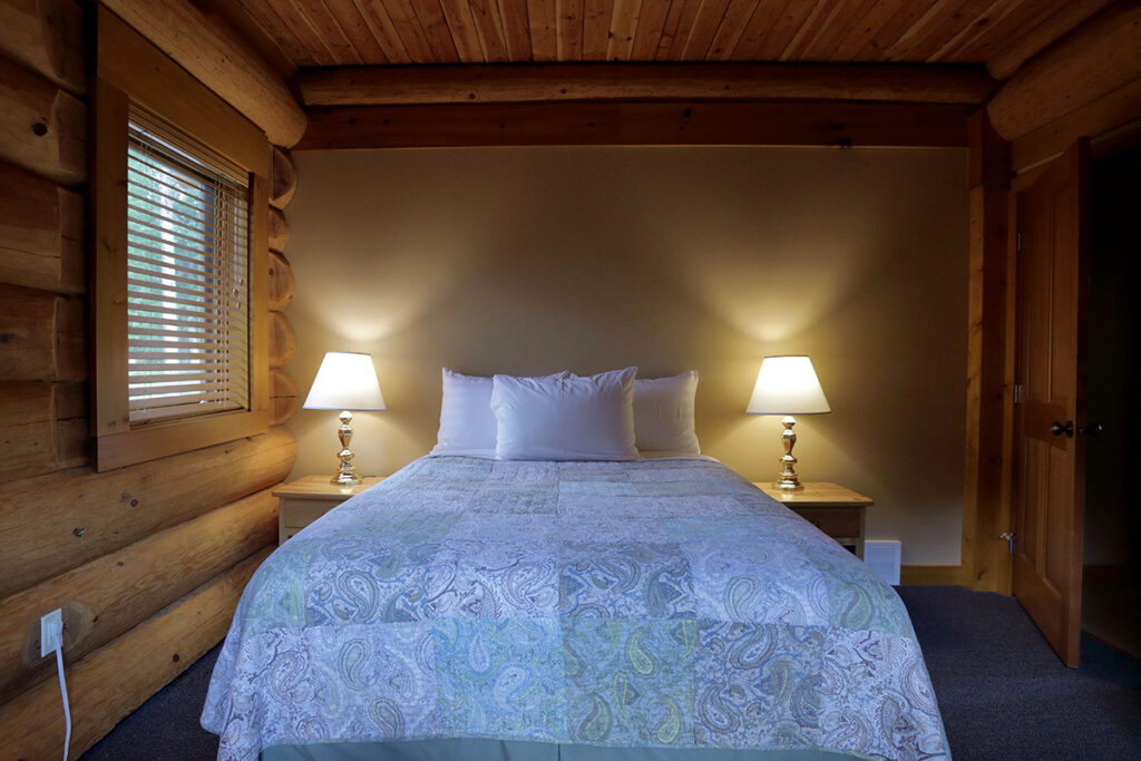 Guest room with king bed in cabin