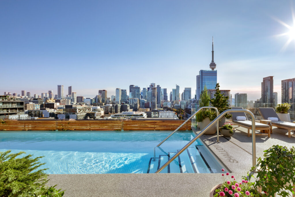 Hotel rooftop pool with view overlooking Toronto skyline