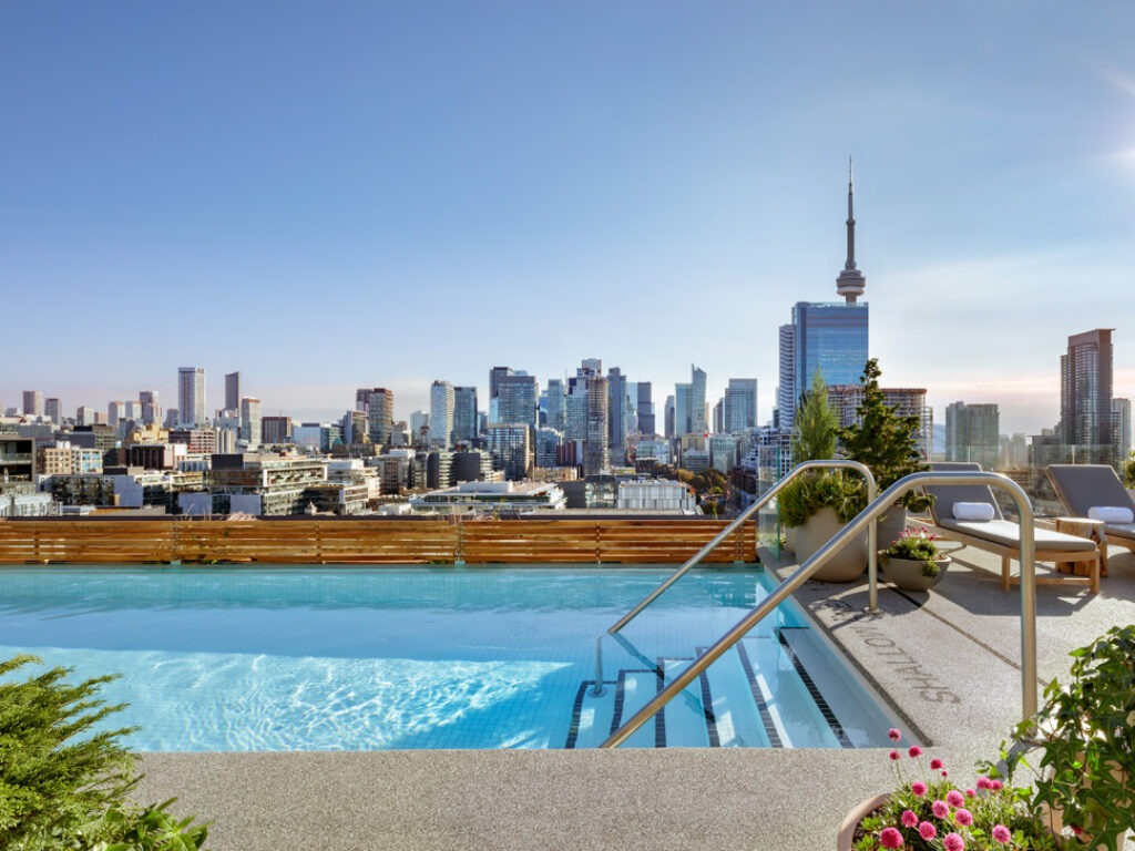 Hotel rooftop pool with view overlooking Toronto skyline